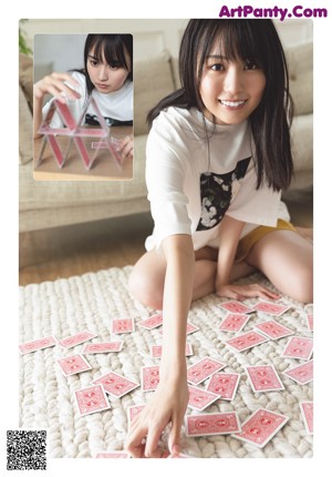 A magazine with a picture of a woman in a striped shirt.