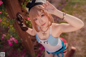 A woman in a sailor outfit posing for a picture.